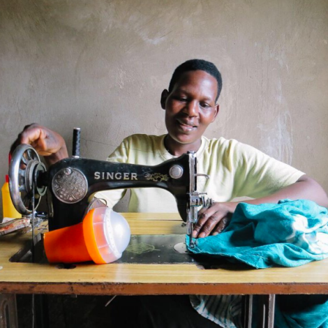 African woman using sowing machine